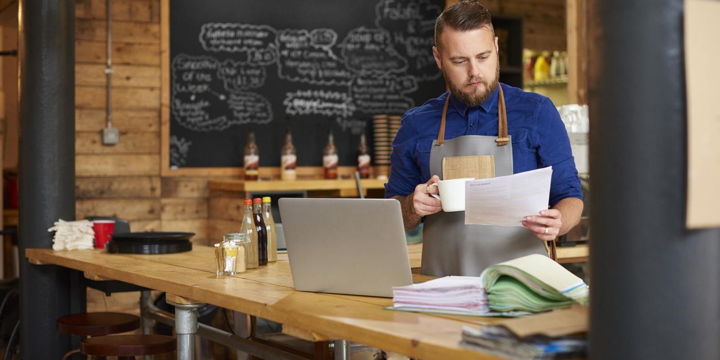 Small business owner reviewing Paycheck Protection Program