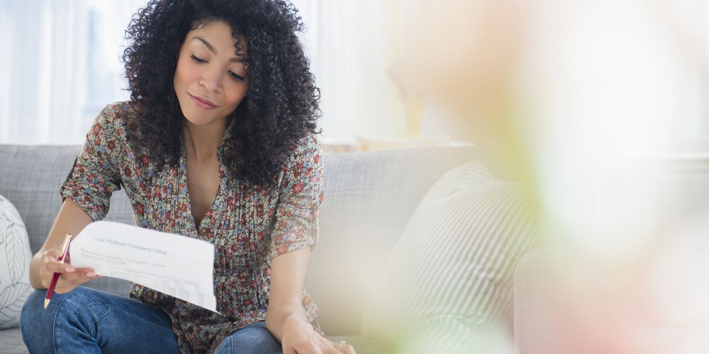 A woman reviews her year-end financial checklist
