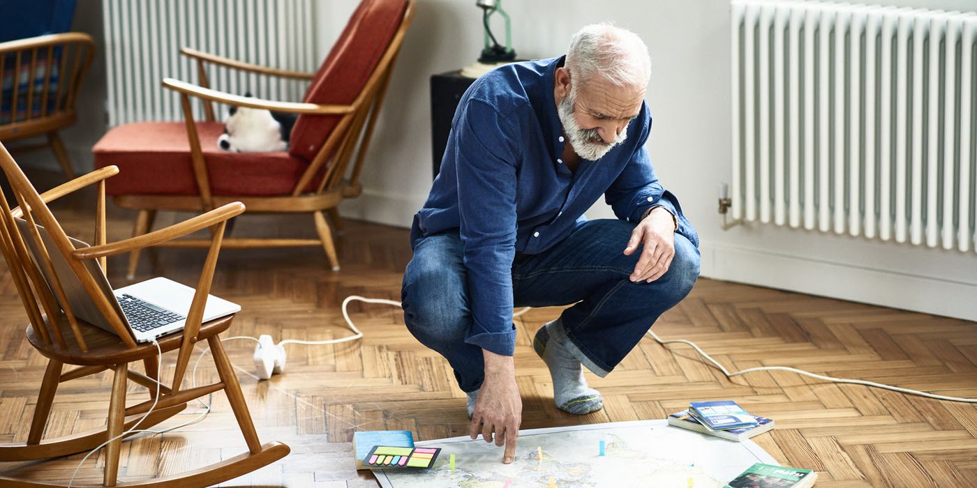 A retired man planning his next trip