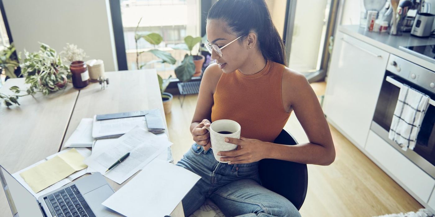 woman at home desk filing taxes early