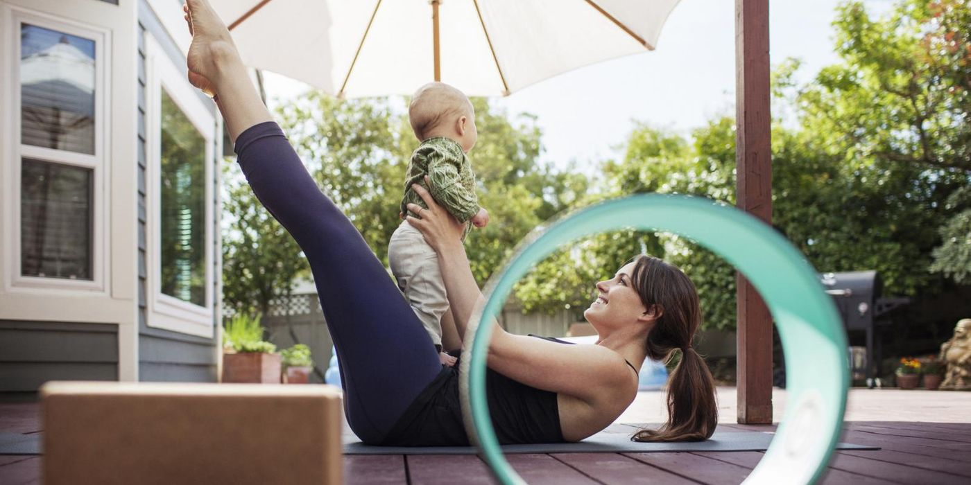 mom on deck doing yoga with baby May Buy Skip