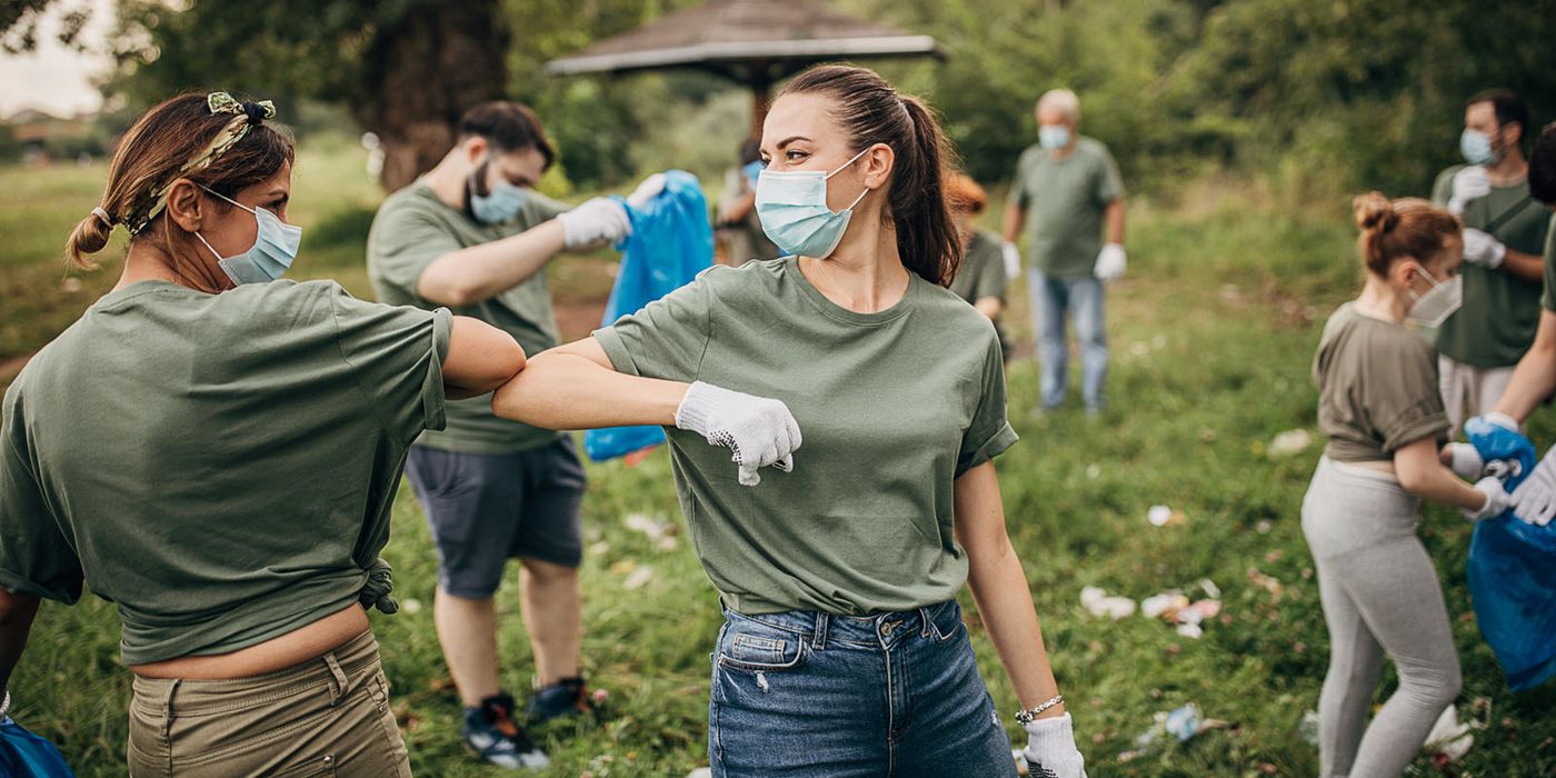 Volunteers cleaning up litter in a park