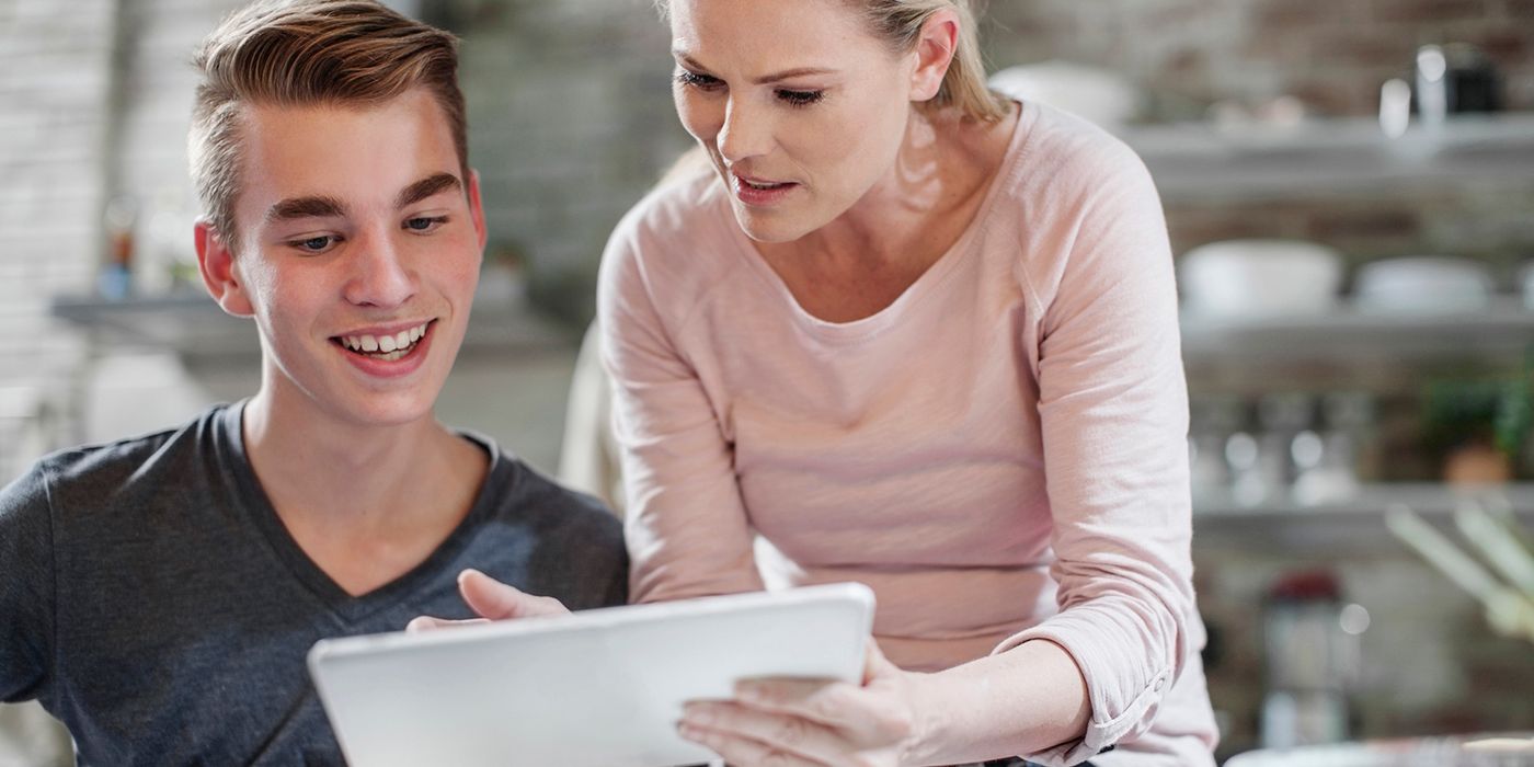 mother and son looking at tablet