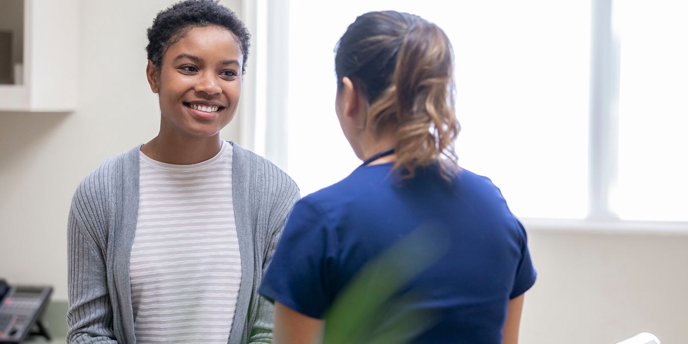 woman speaking with doctor