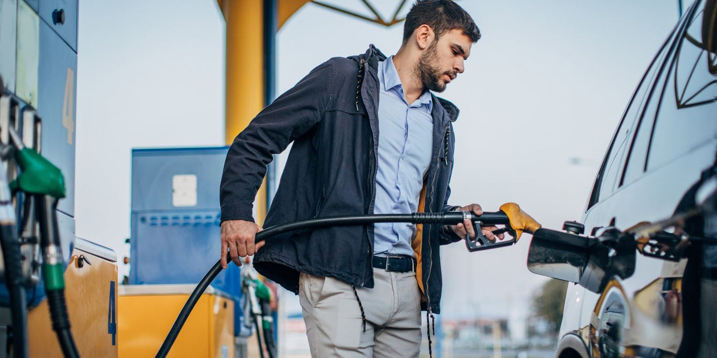 Man filling his gas tank at a service station
