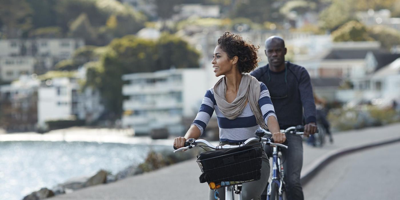 couple with financial flexibility riding bikes