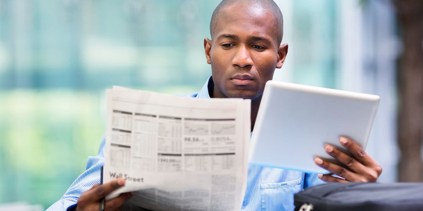 Man looking at the difference between stocks and bonds