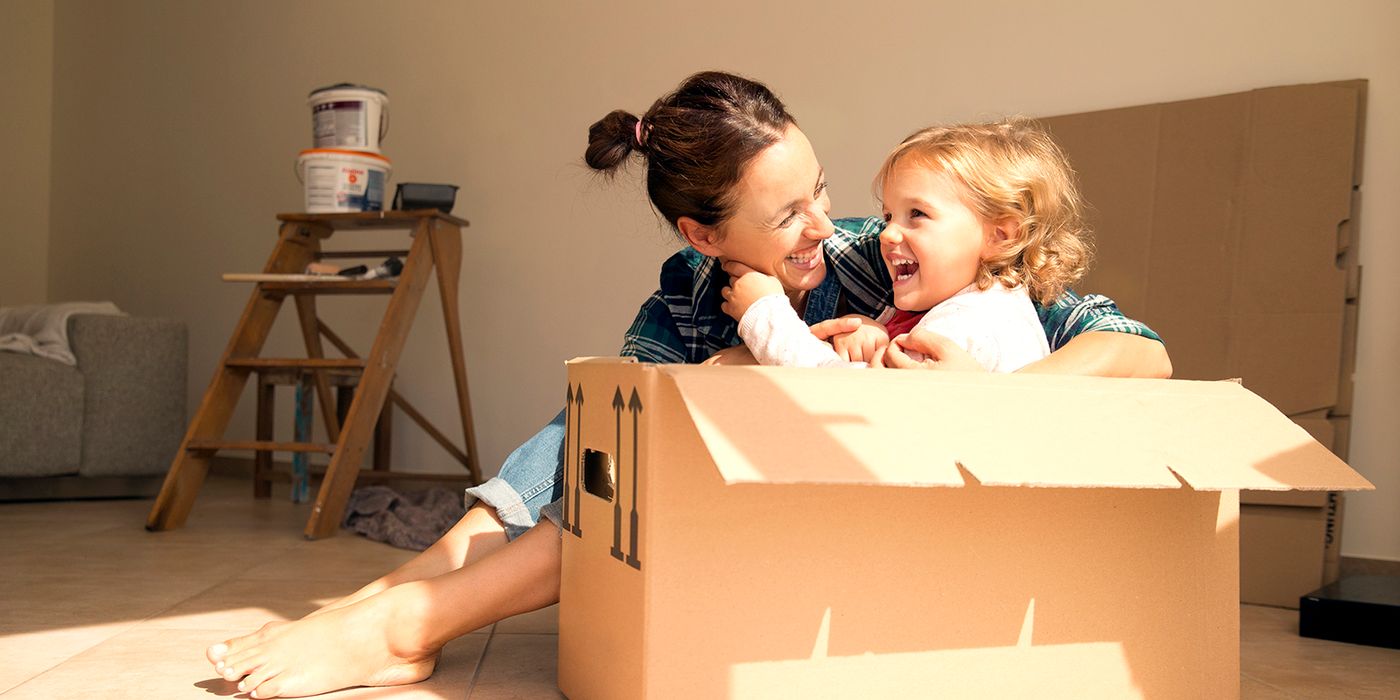 Mom with daughter in a moving box.