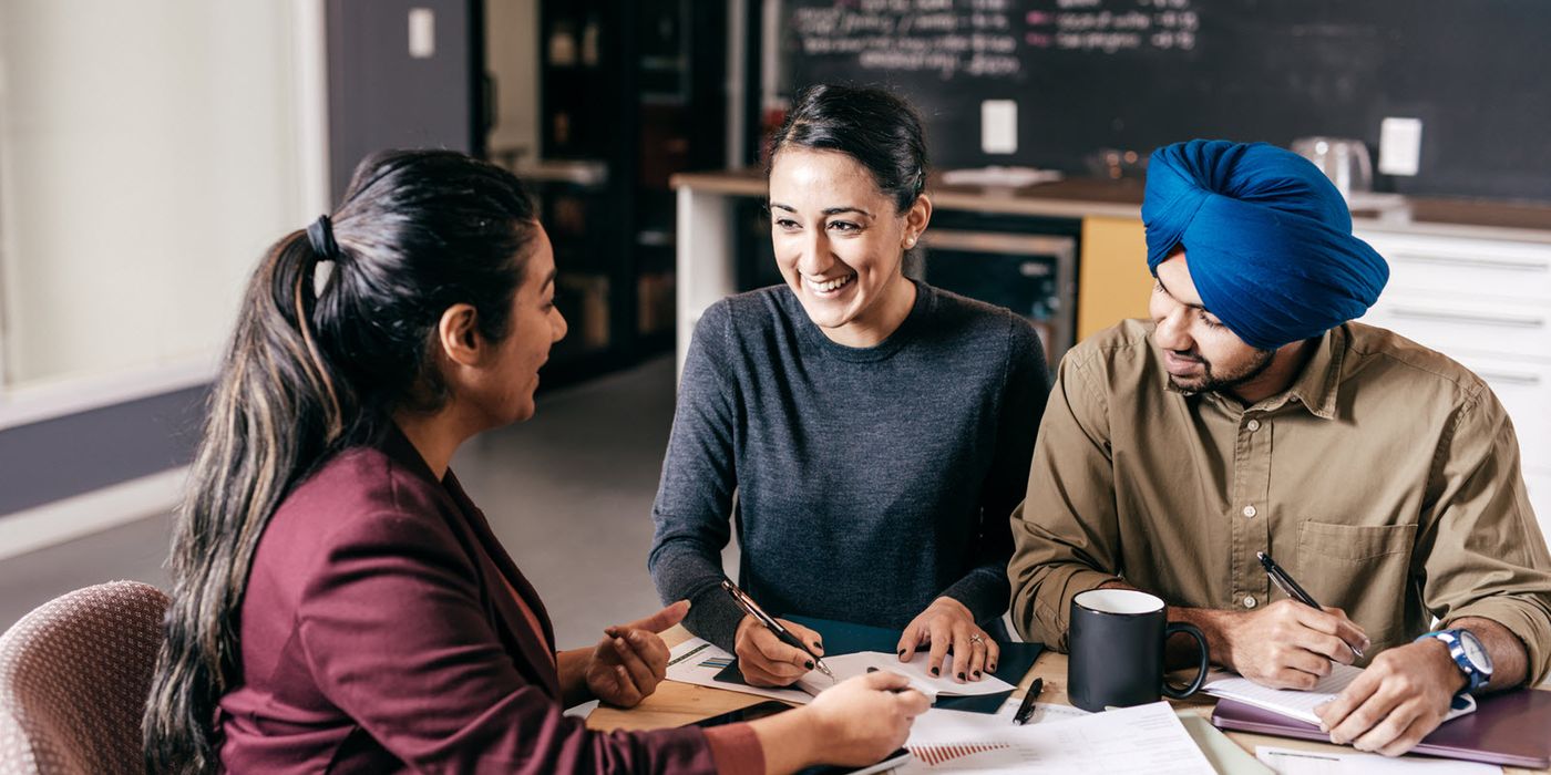 A couple reviews their universal life insurance options