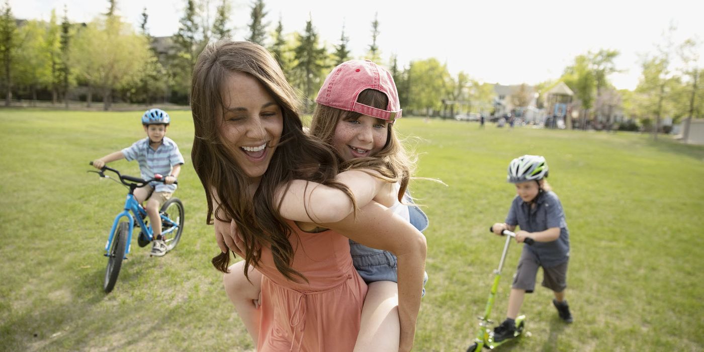 Mom with her kids in a park 