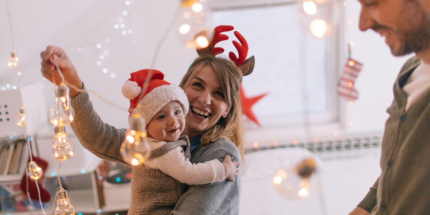 new parents celebrating the holidays with baby