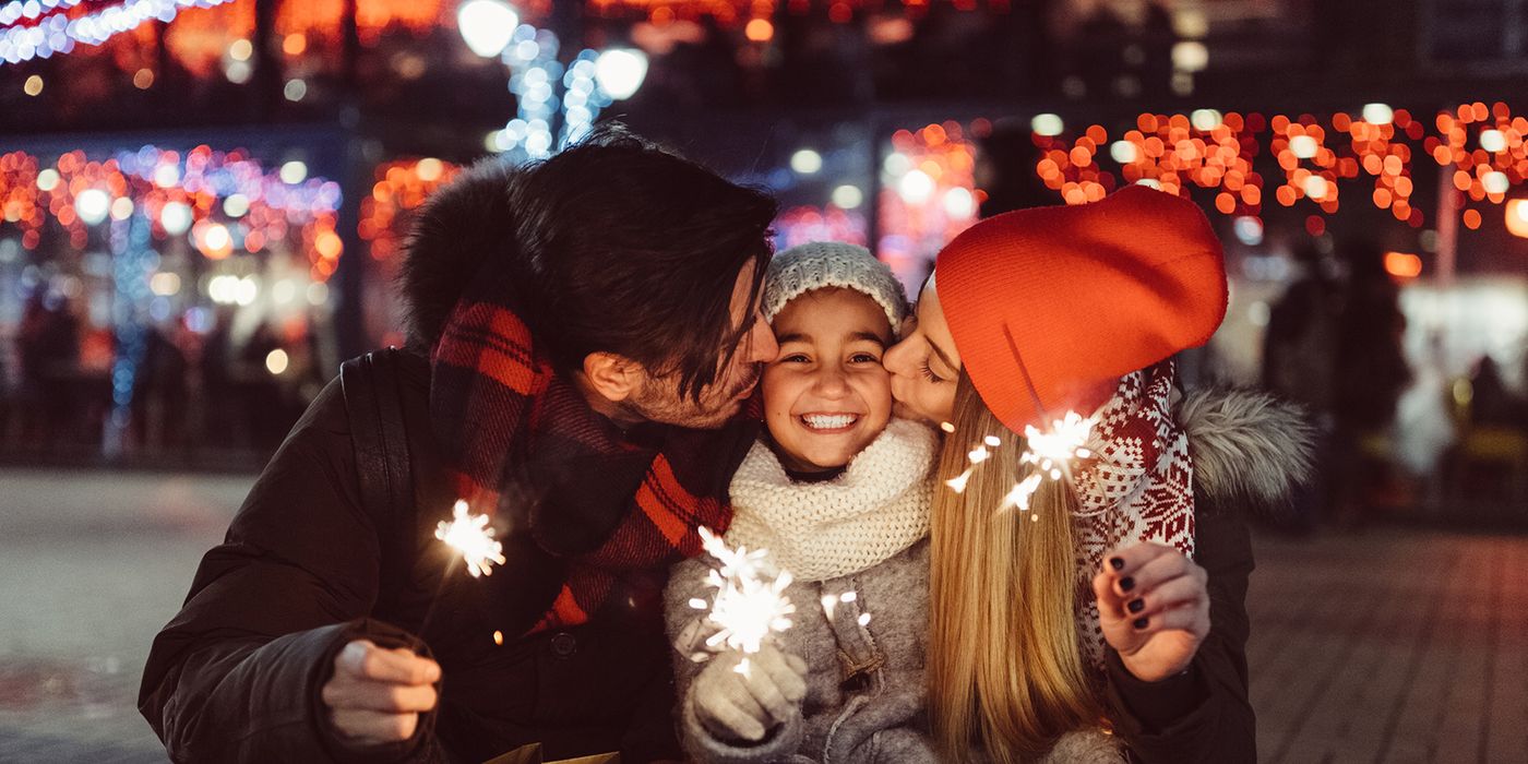 family holding sparklers