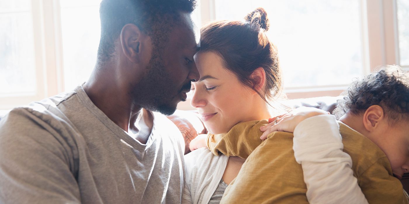 couple with young baby sharing a moment
