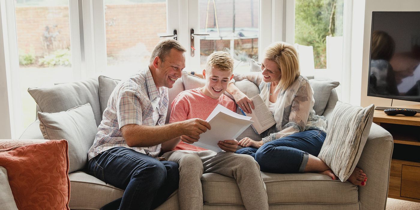 Family sitting on a coach reviewing steps to take before your child turns 18.