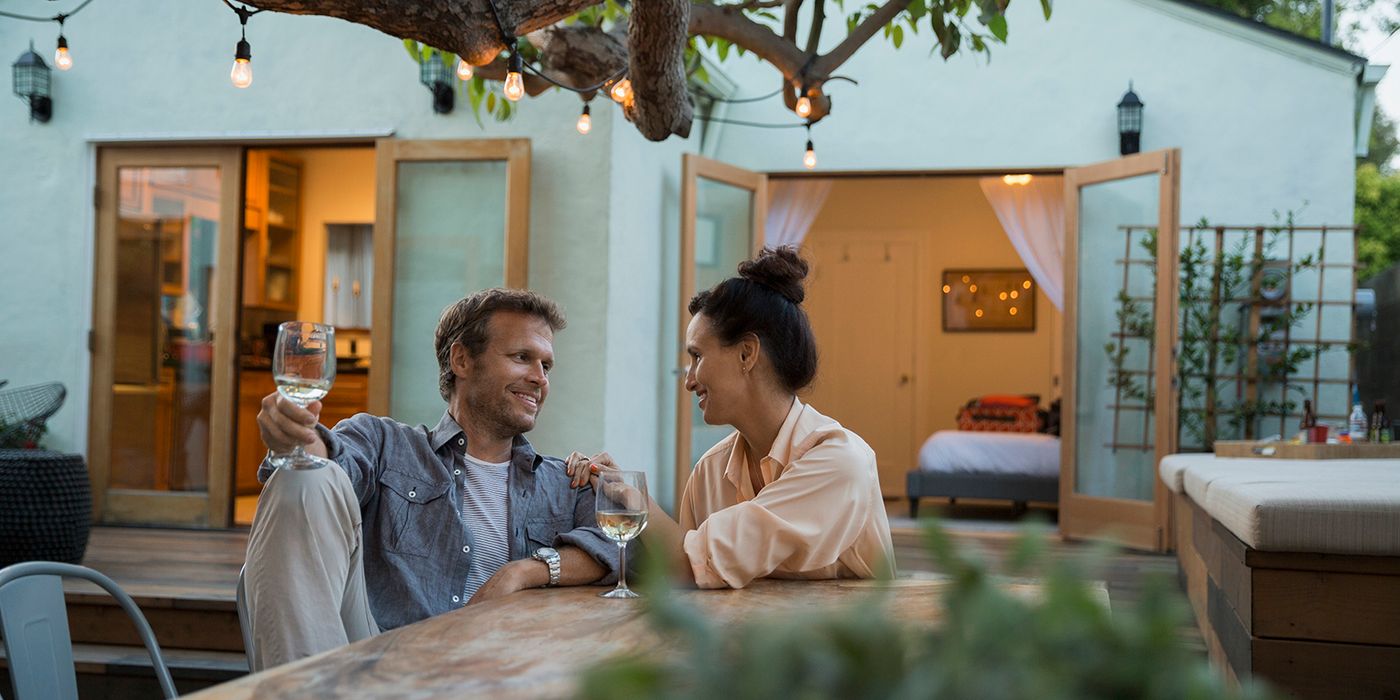 couple discussing financial habits over wine