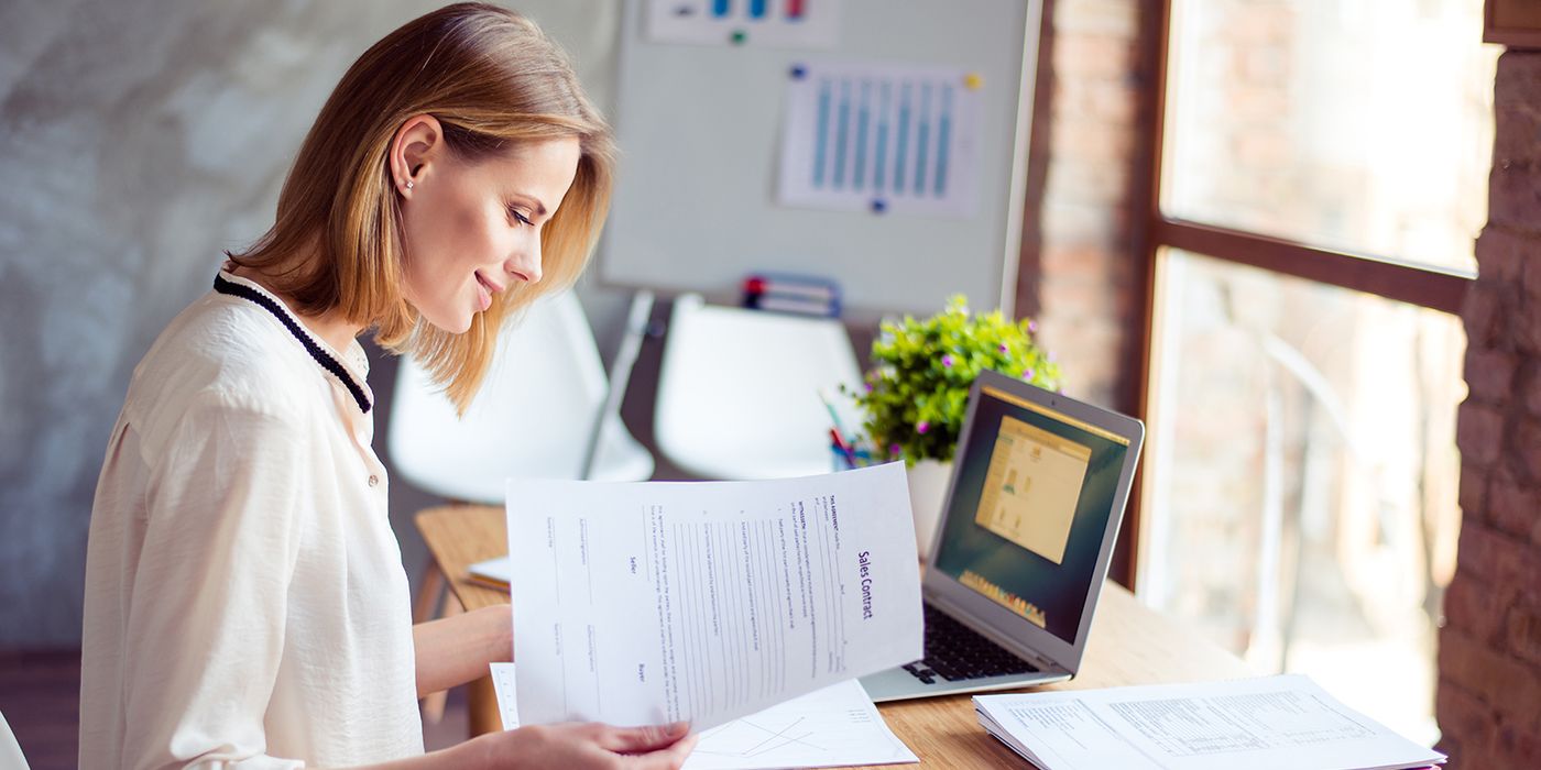 woman applying KonMari method on financial paperwork