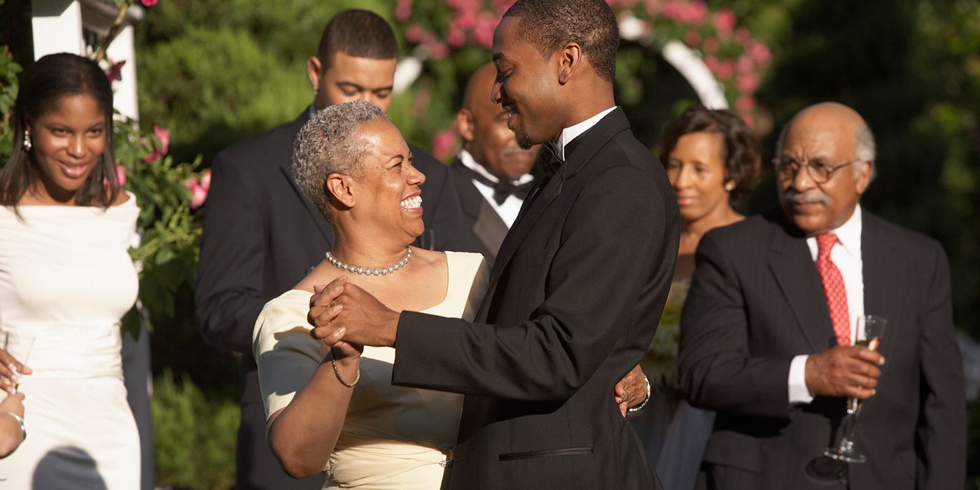 mother and son dancing at wedding