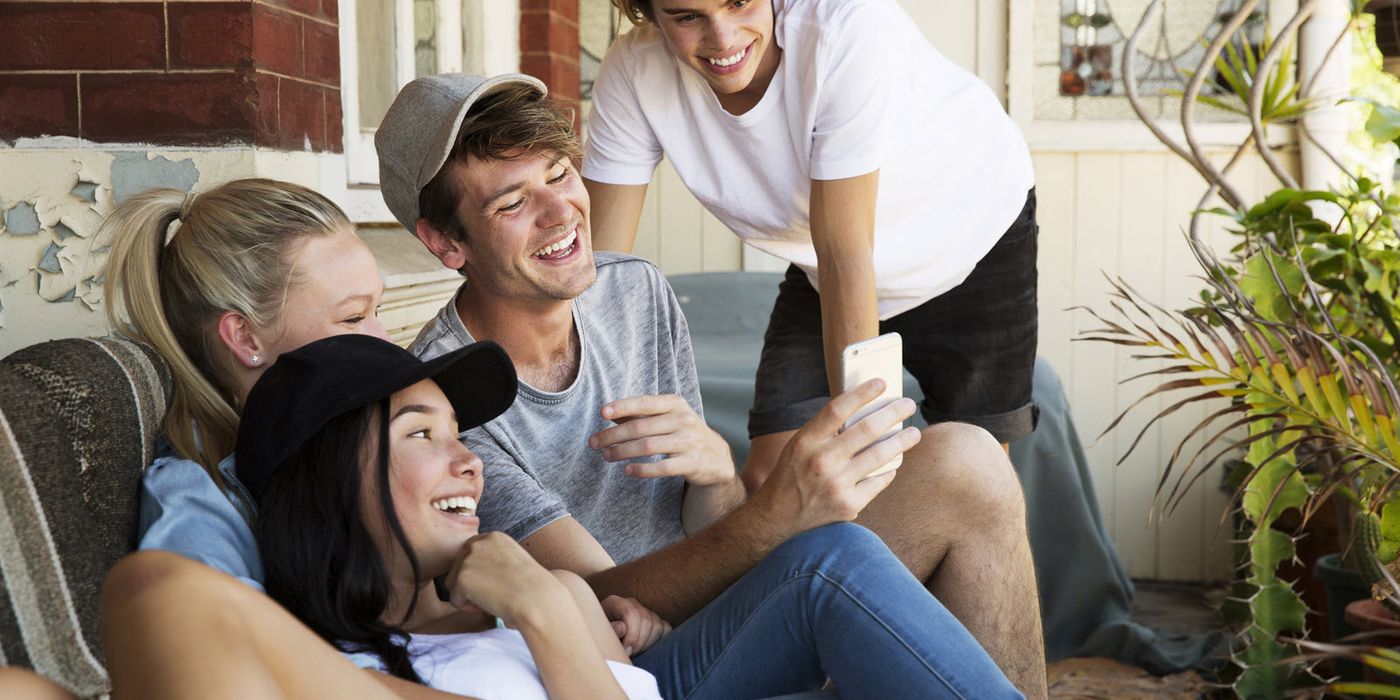 Teenagers taking a selfie and discussing what their parents make their kids pay for.