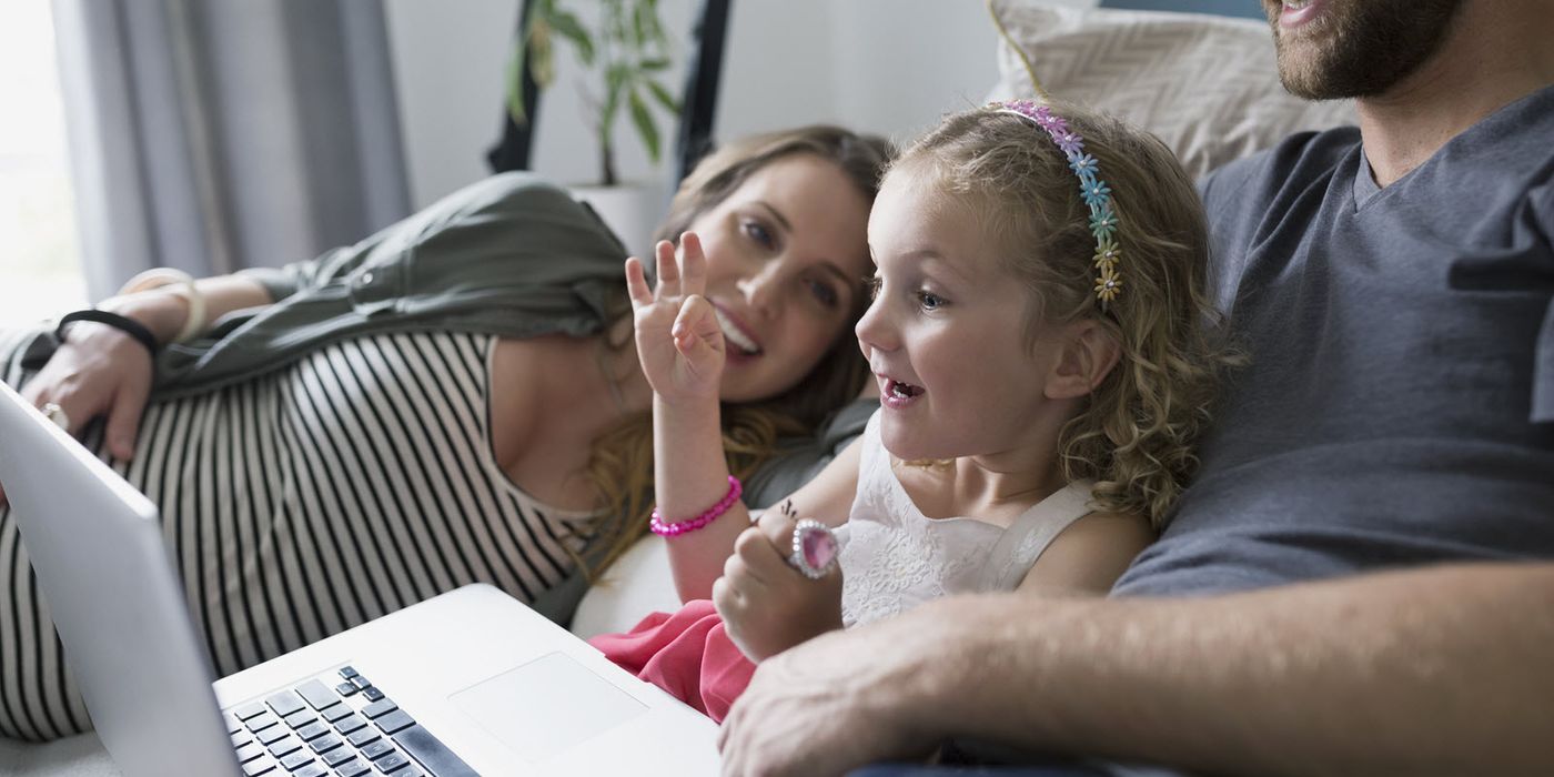 Family reading about the different types of life insurance. 