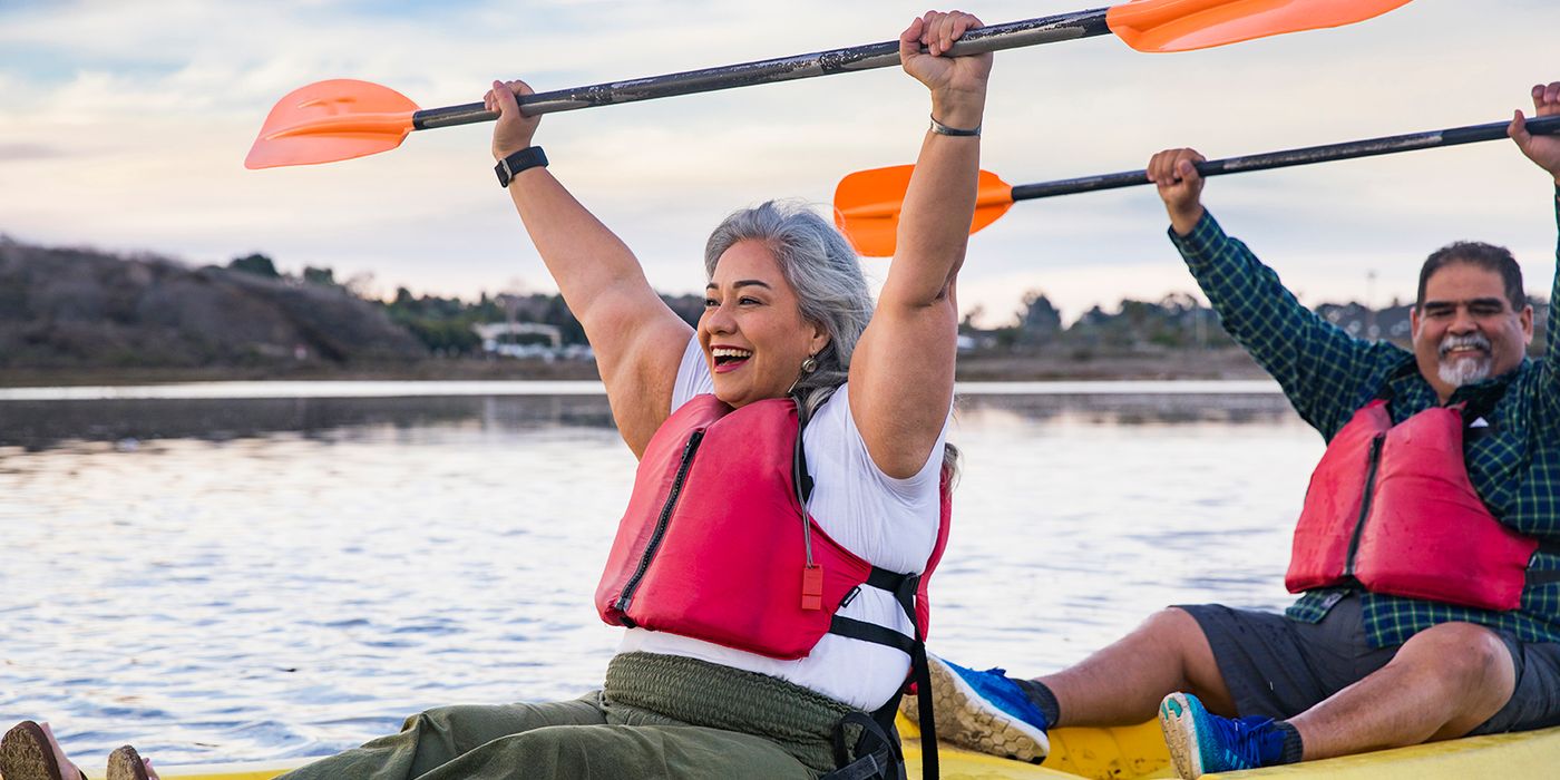 senior couple kayaking in retirement