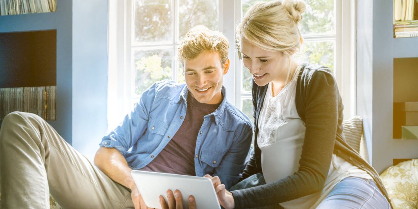 Couple taking a quiz to find out if they’re financially ready for a baby.