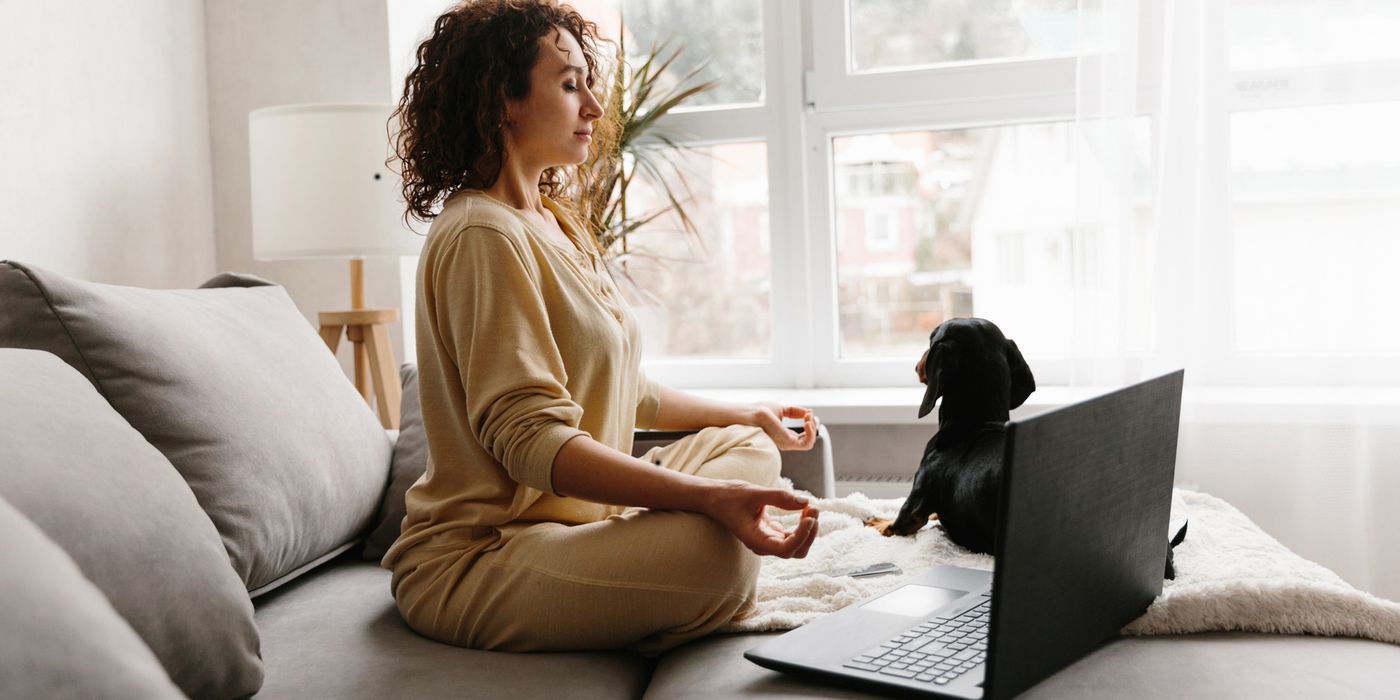 woman in lotus pose practicing self-care