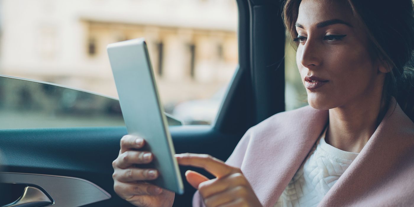 woman-checking-ira-contribution-on-tablet