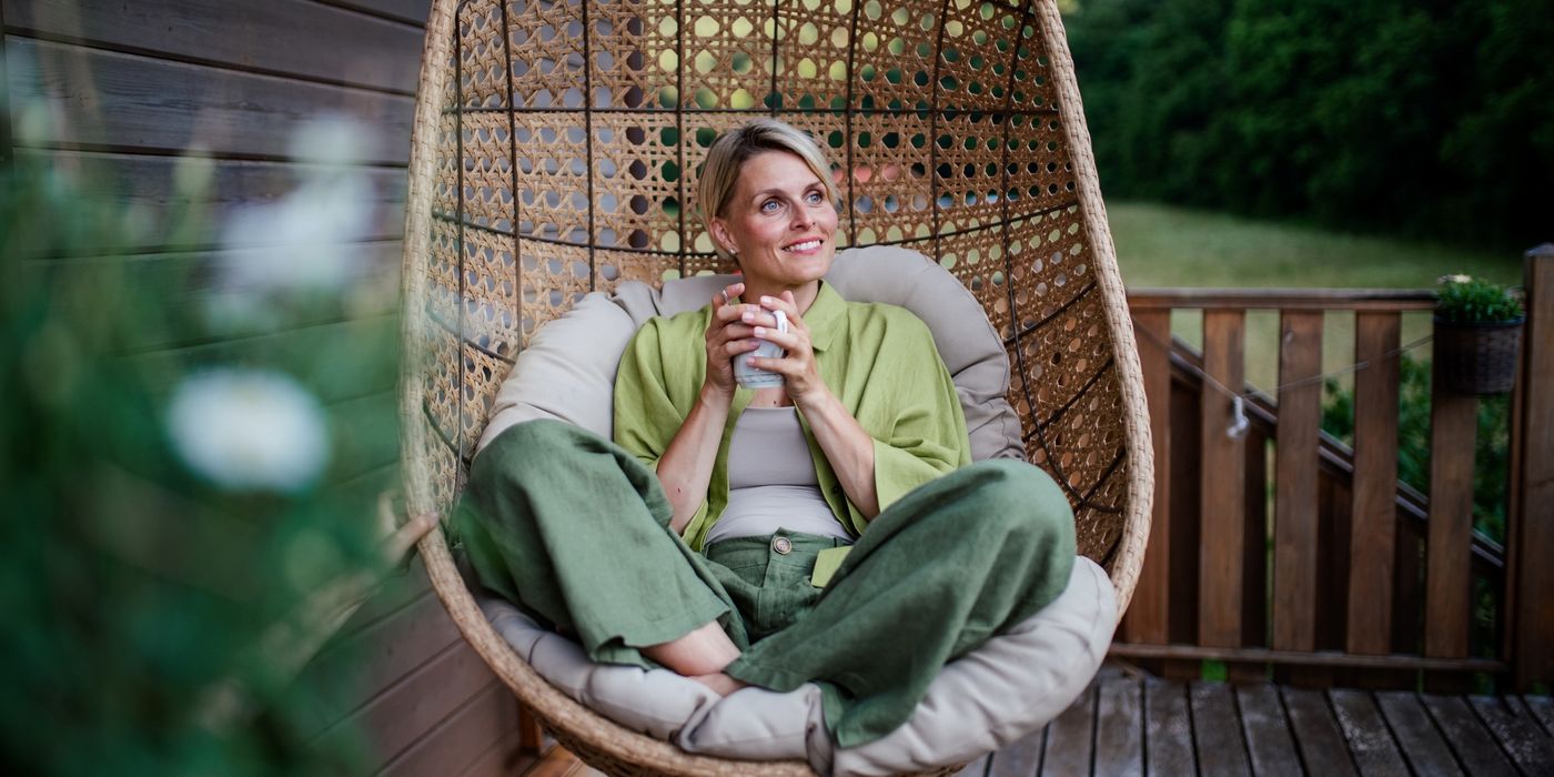 Woman feeling financially confident and enjoying her newly purchased home.