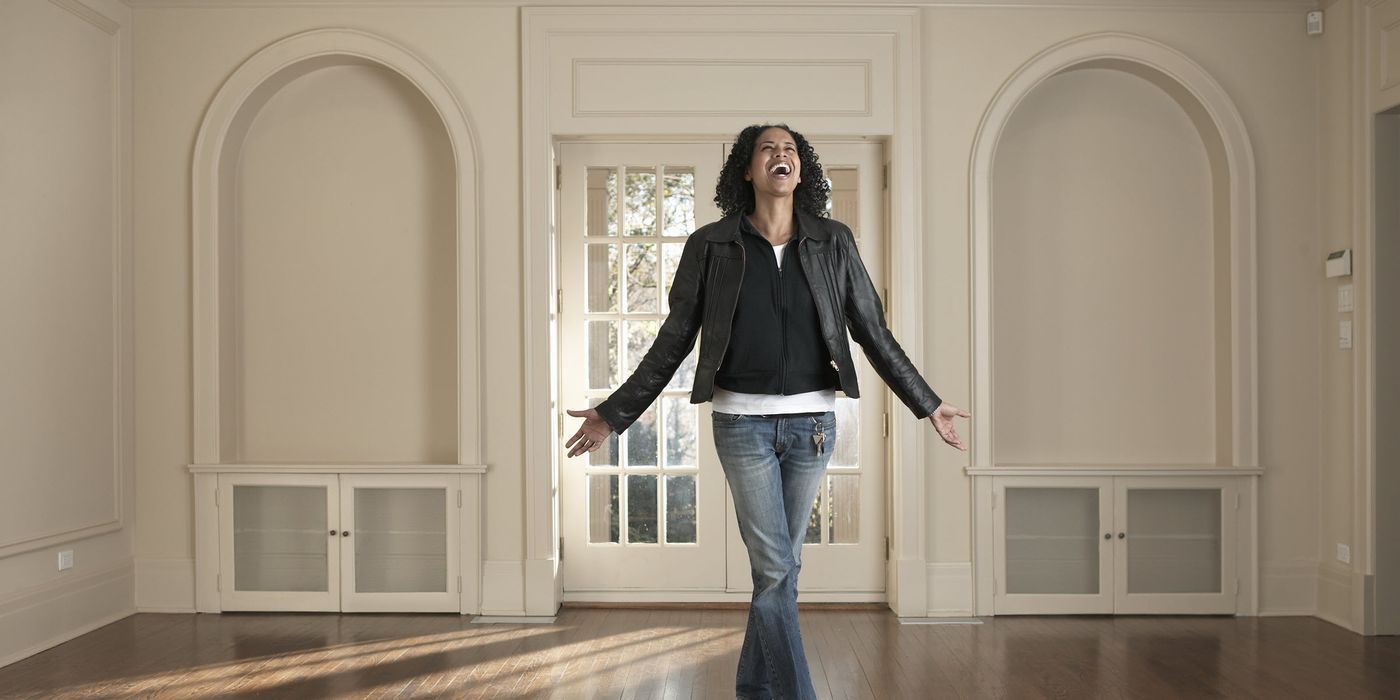 Woman in the living room of a home she wants to buy