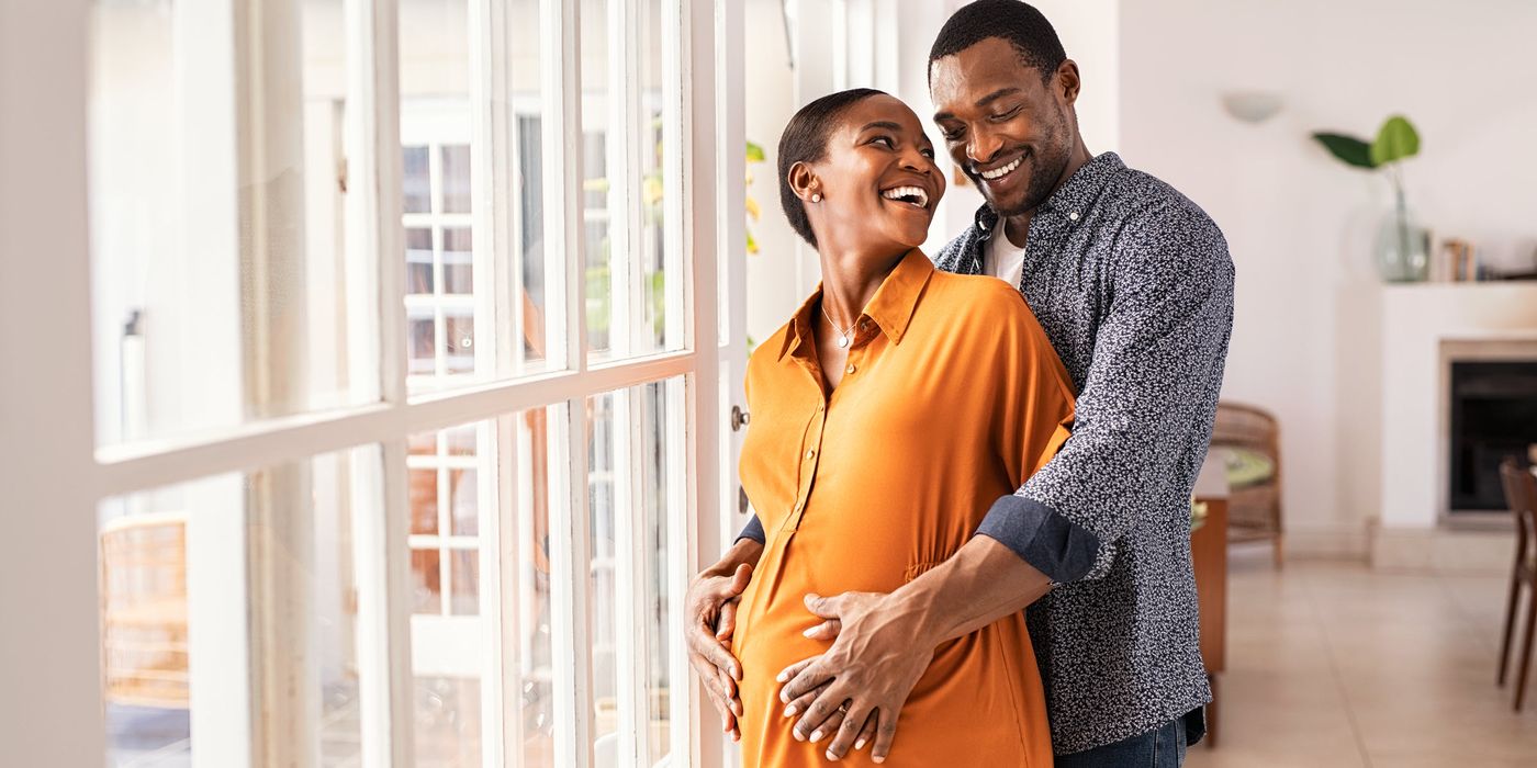 Pregnant couple thinking about life insurance for new parents
