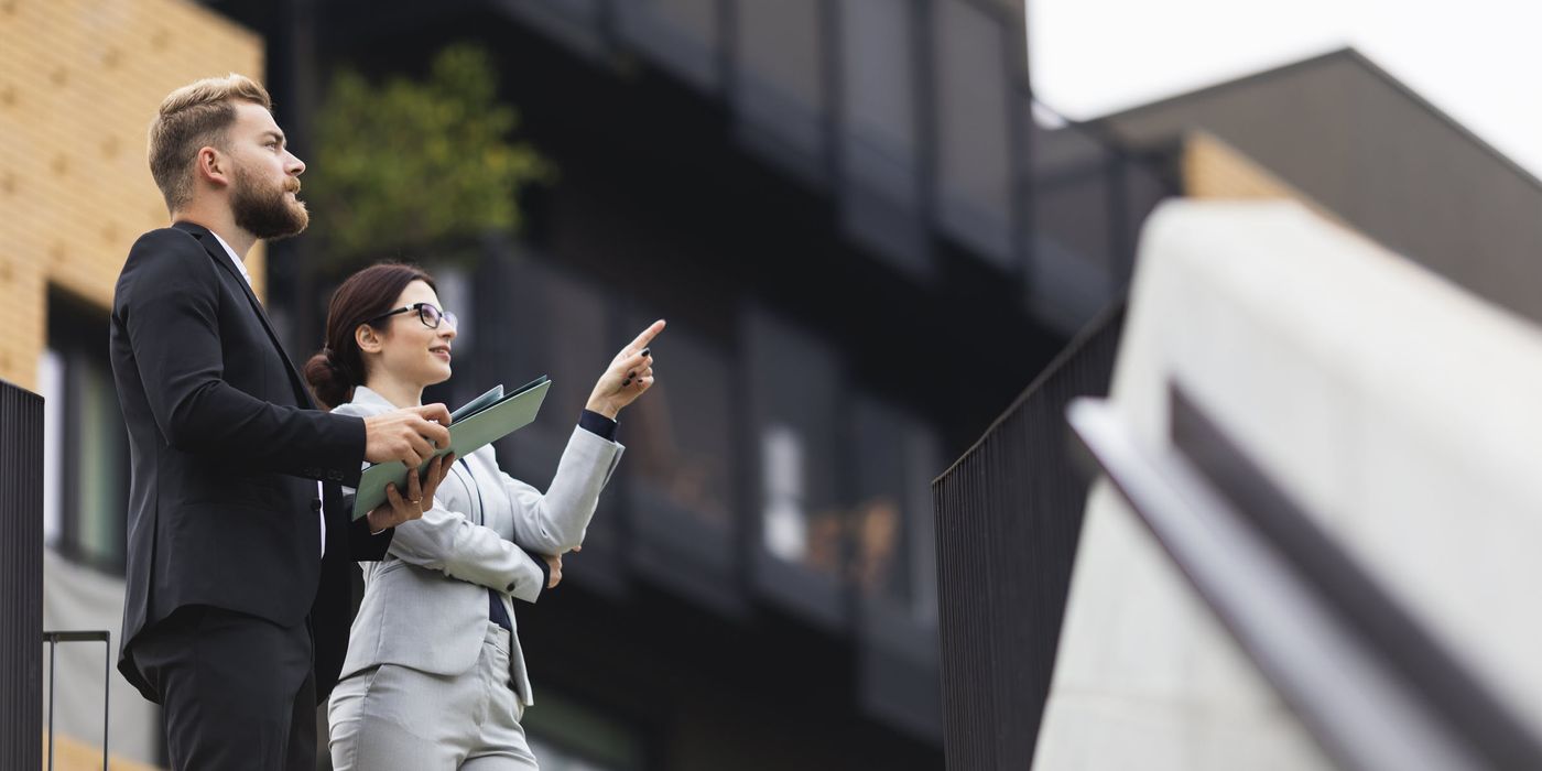 Woman and man looking at investment property