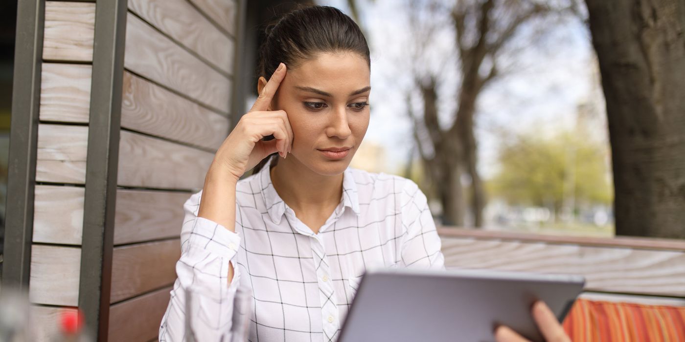 Woman reading news on a tablet