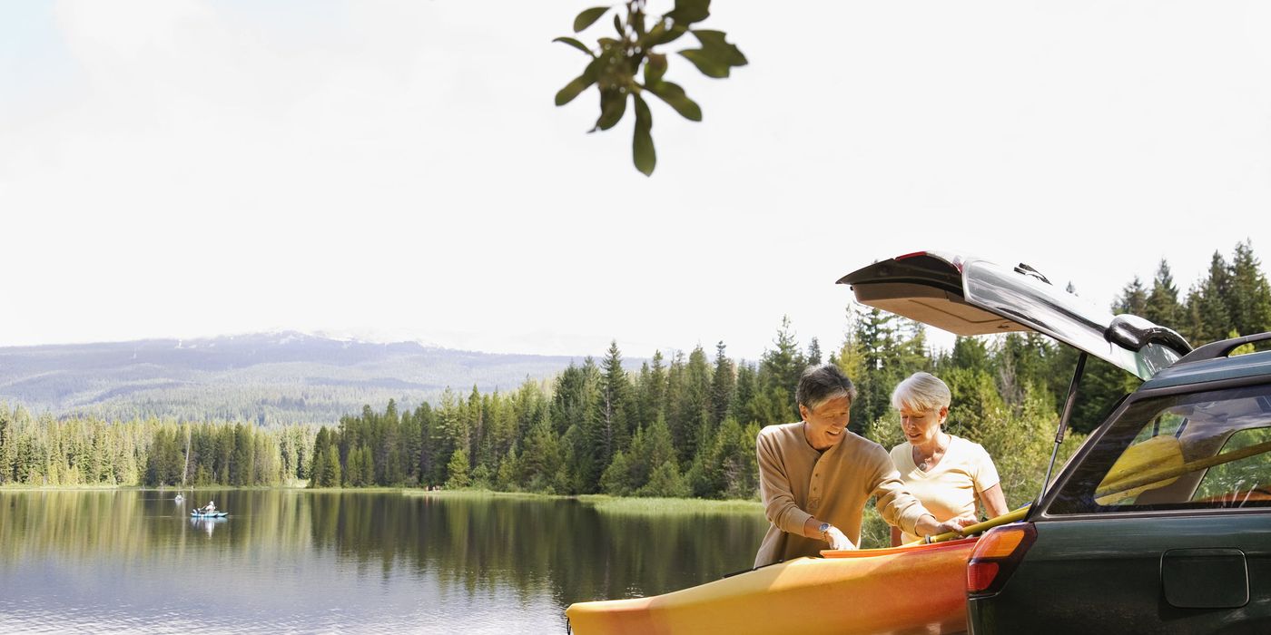 man and woman in retirement kayaking 