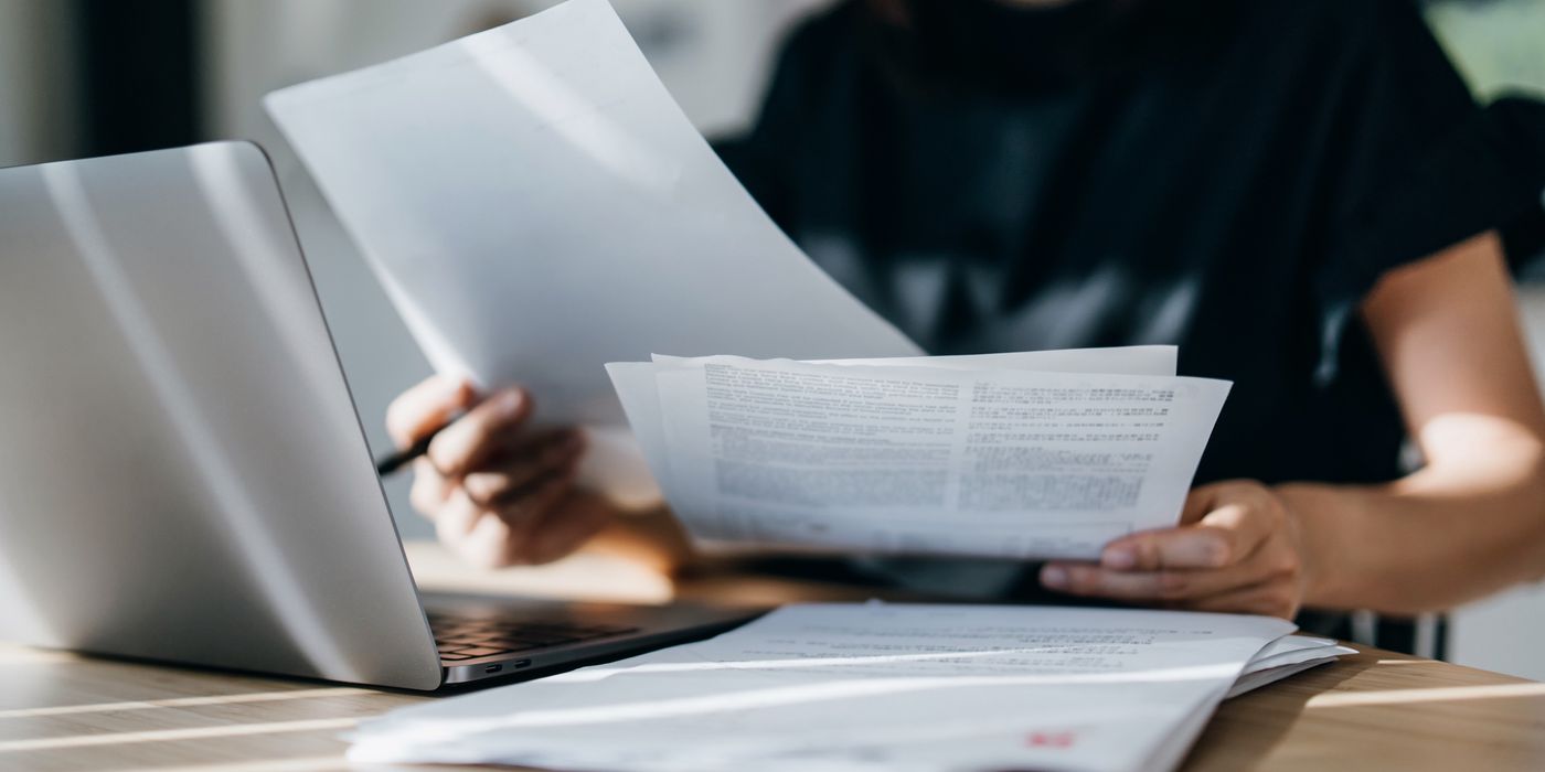 Woman looking up how you calculate your taxes