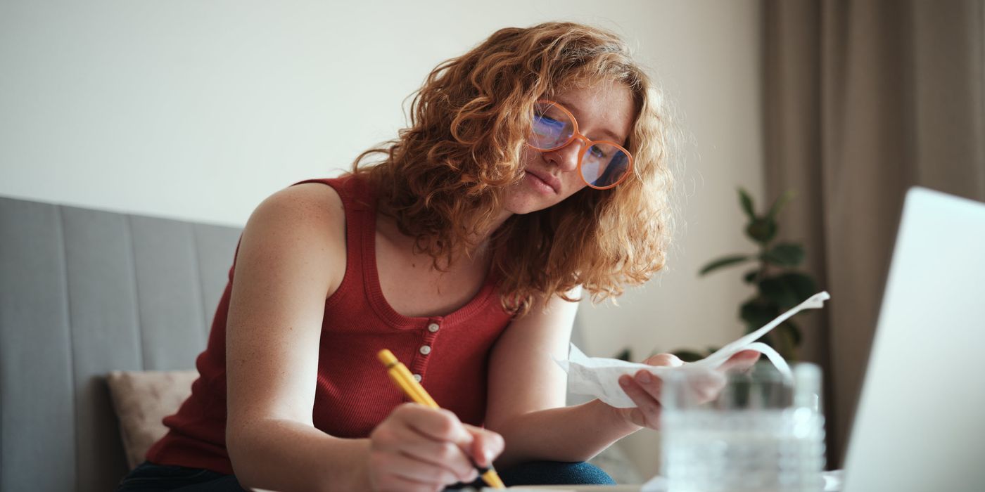young woman calculating spend