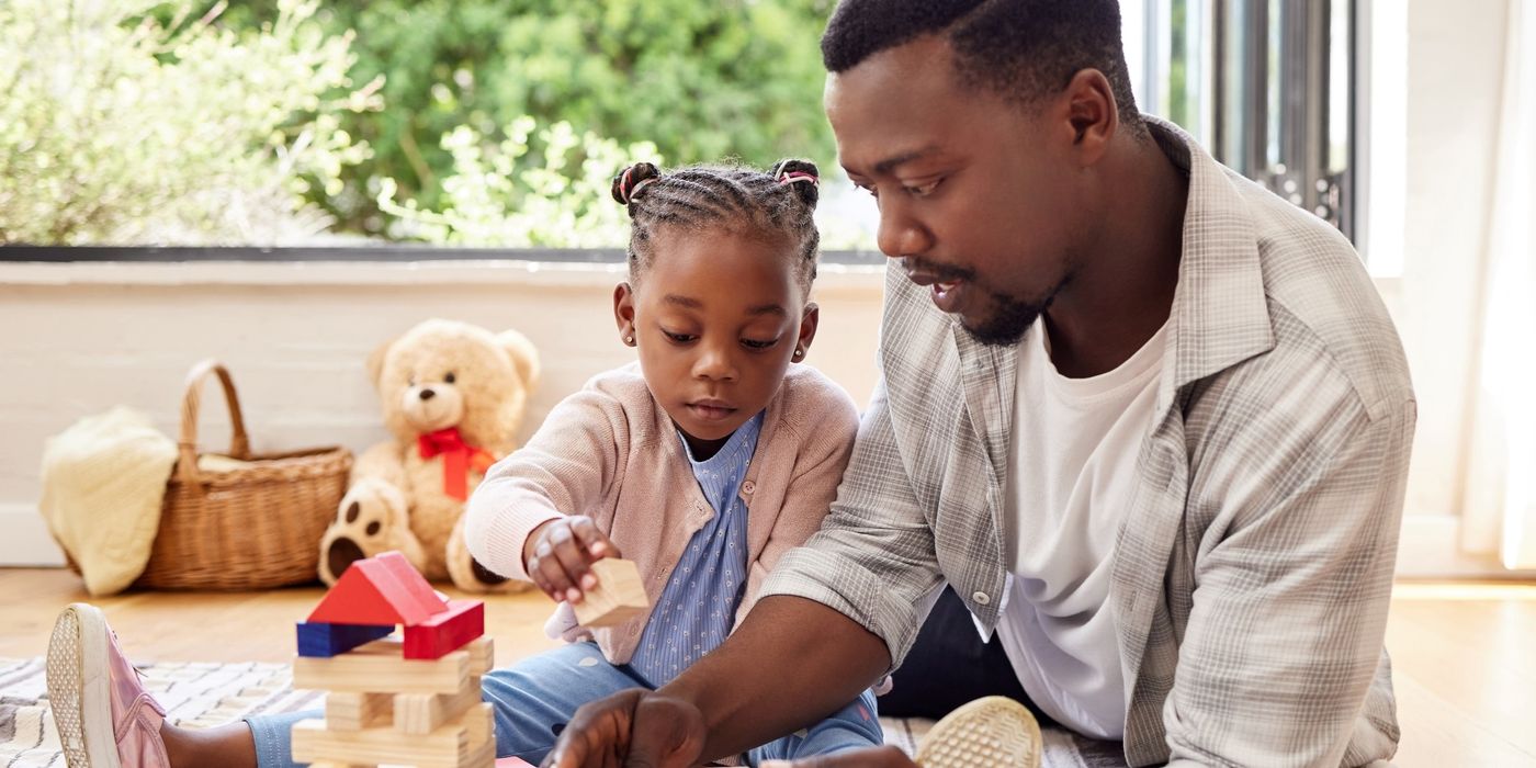 a child plays with toy blocks at home