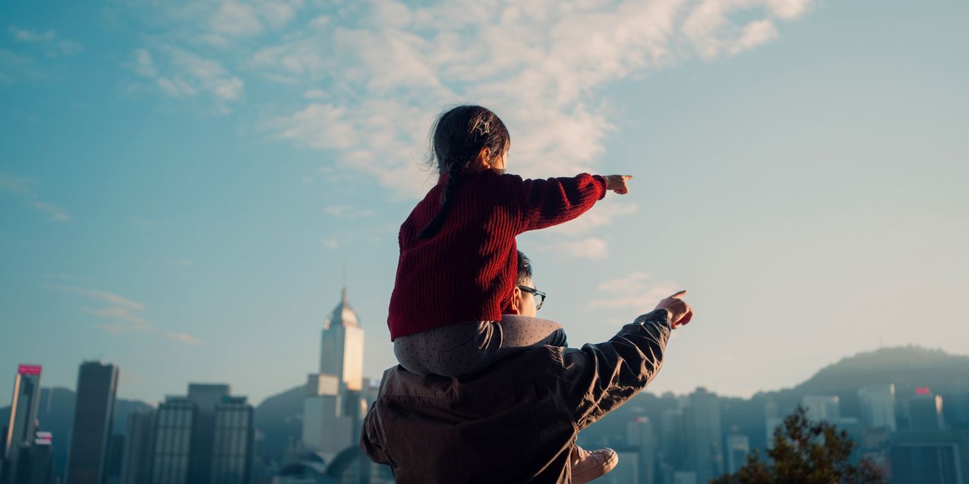  Father carrying his daughter and thinking about her future.