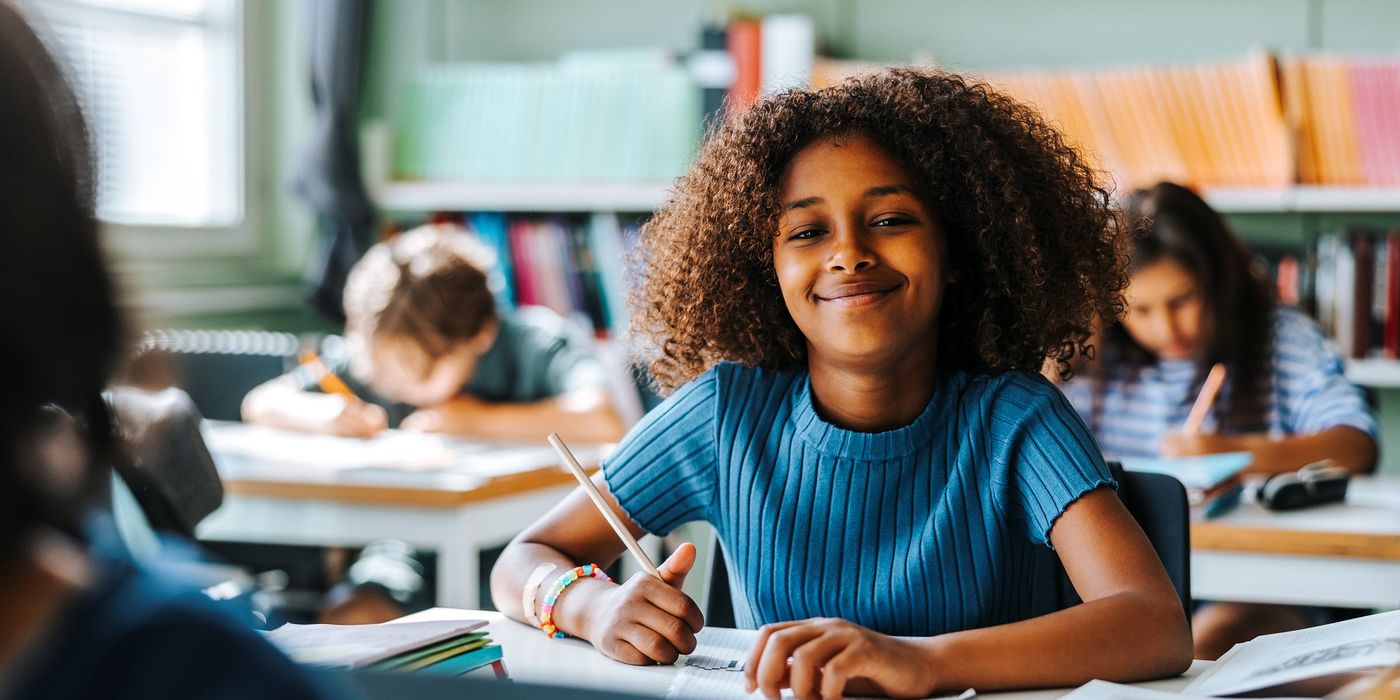 Young, happy student eager for the opportunity to learn and grow at school.