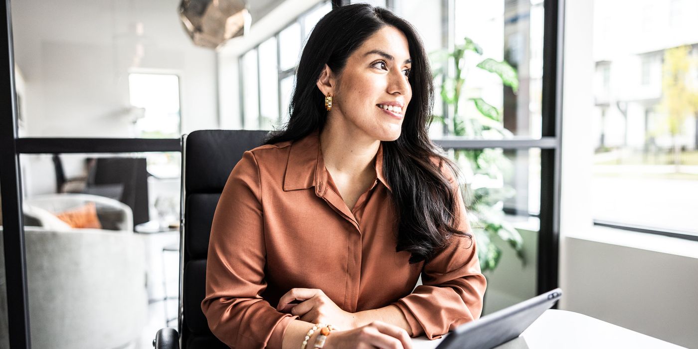 A businesswoman reflects on the importance of diversification and a well-balanced investment portfolio, crafted with her financial advisor at Northwestern Mutual.