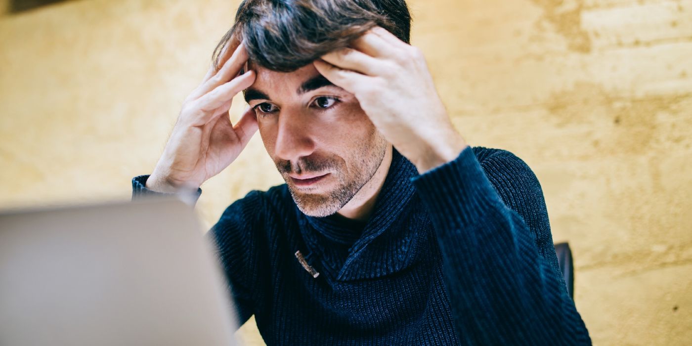 man frustrated with internet fraud