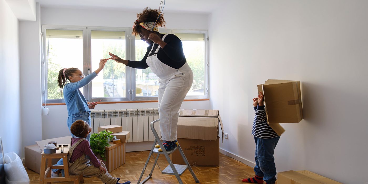 A mother with her two kids moving into a new home