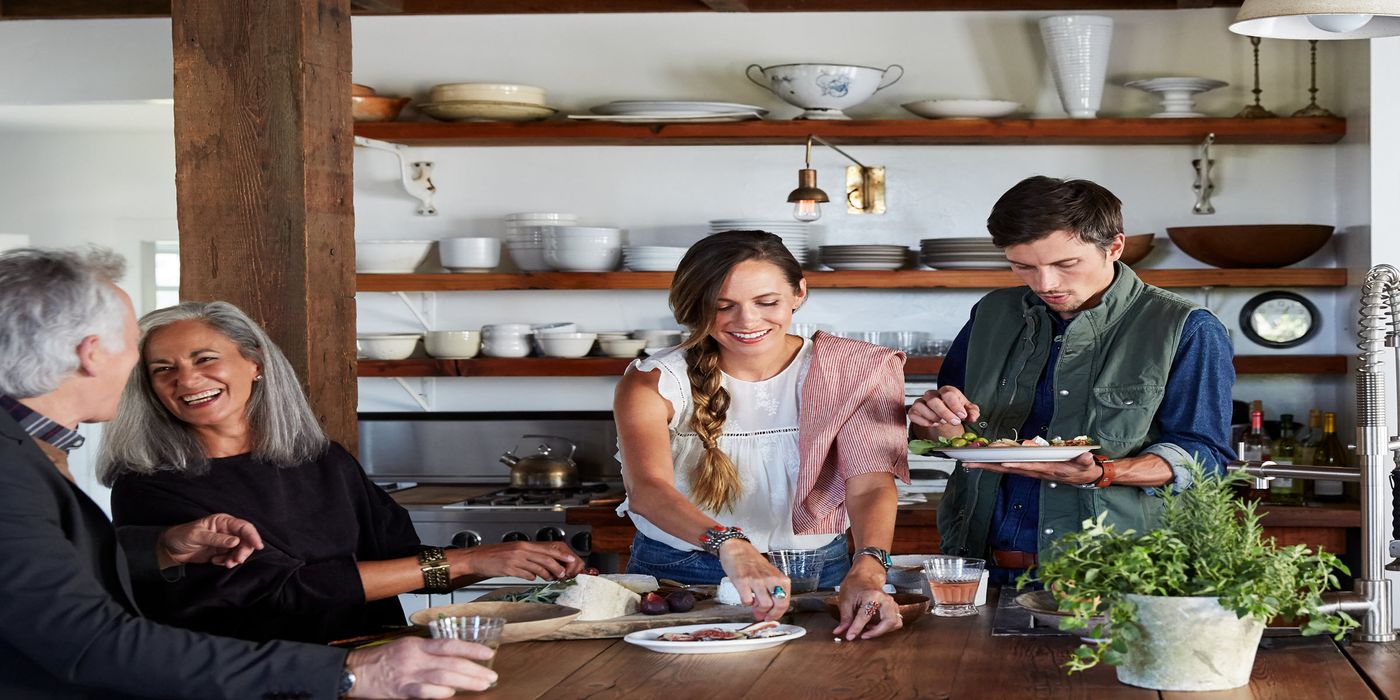 family cooking together in kitchen