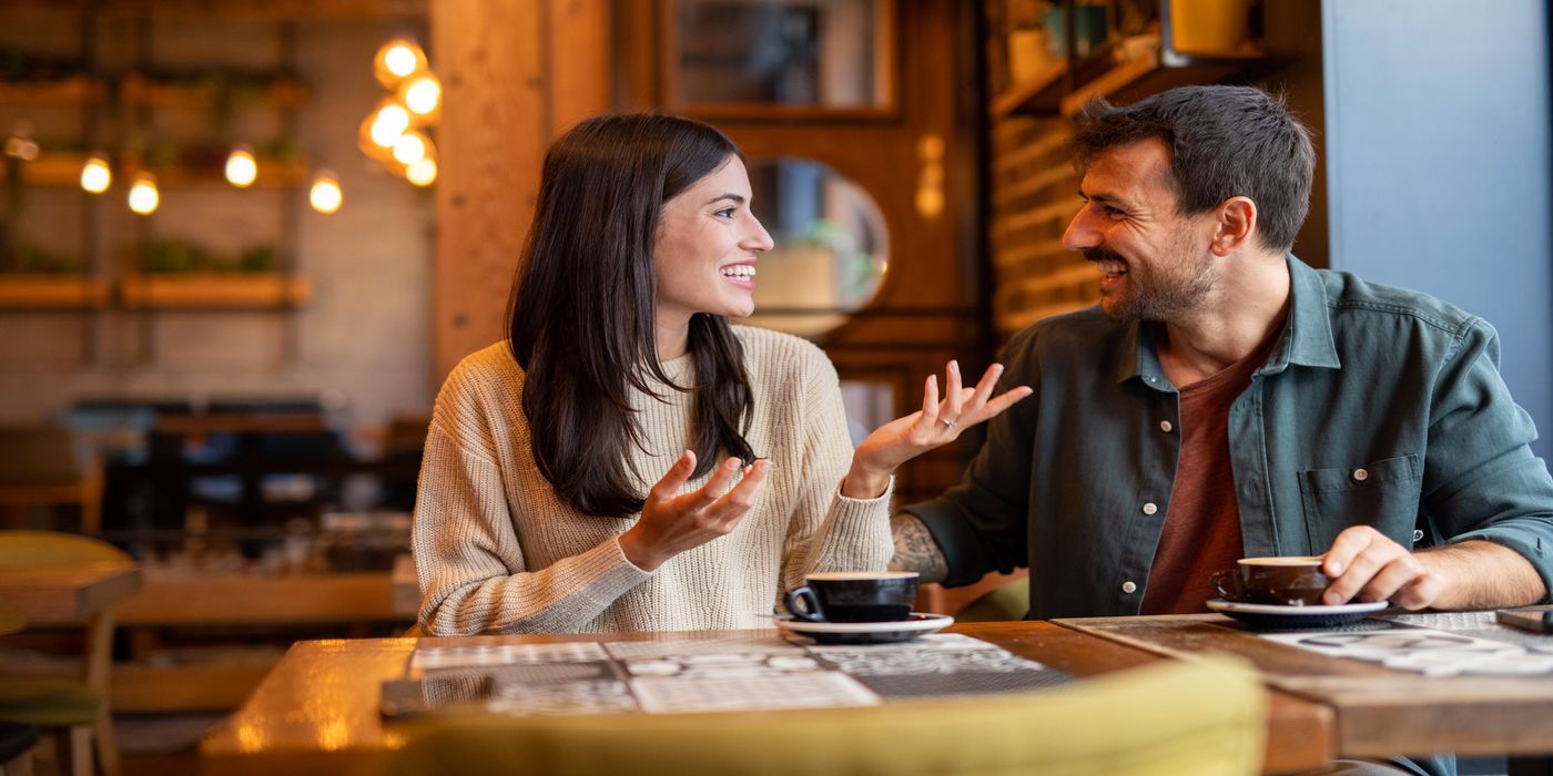 Happy couple having a coffee date in cafe