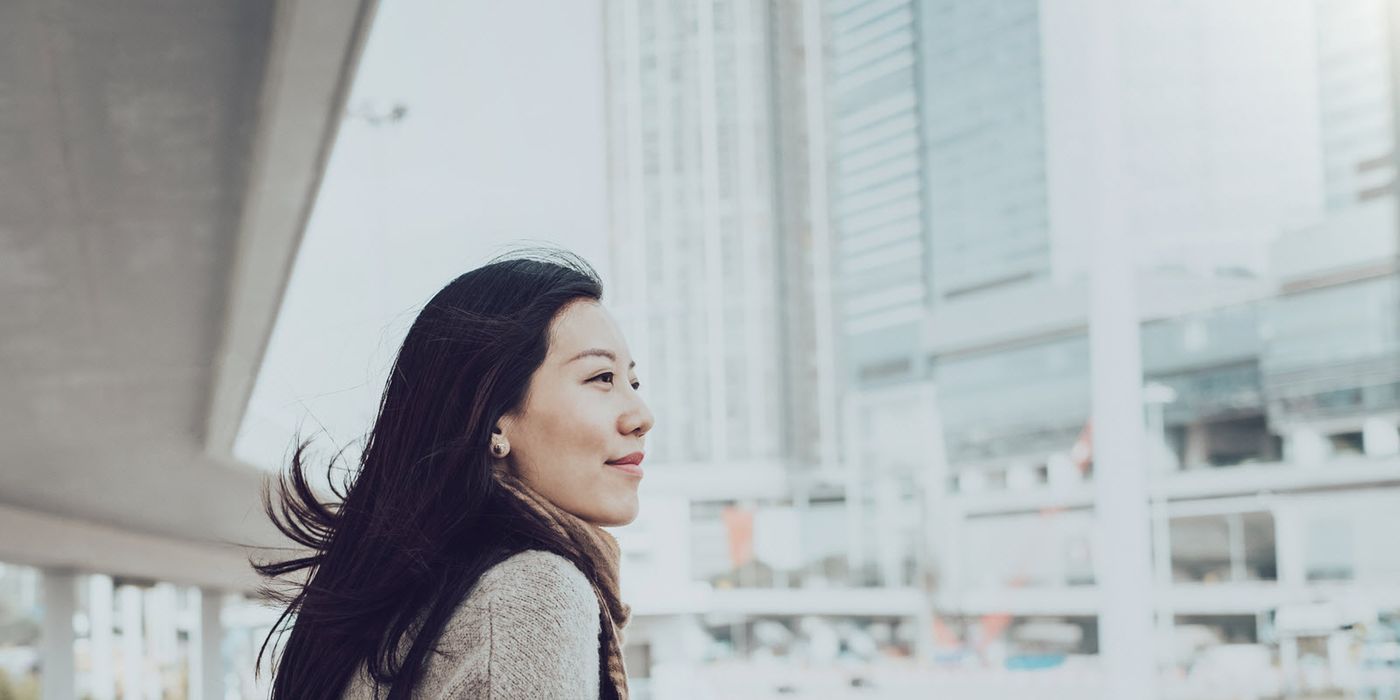 A woman looks to cross the street
