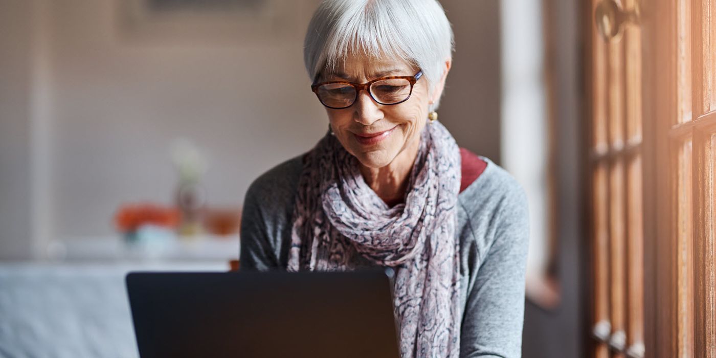 Woman reading Northwestern Mutual Market Commentary