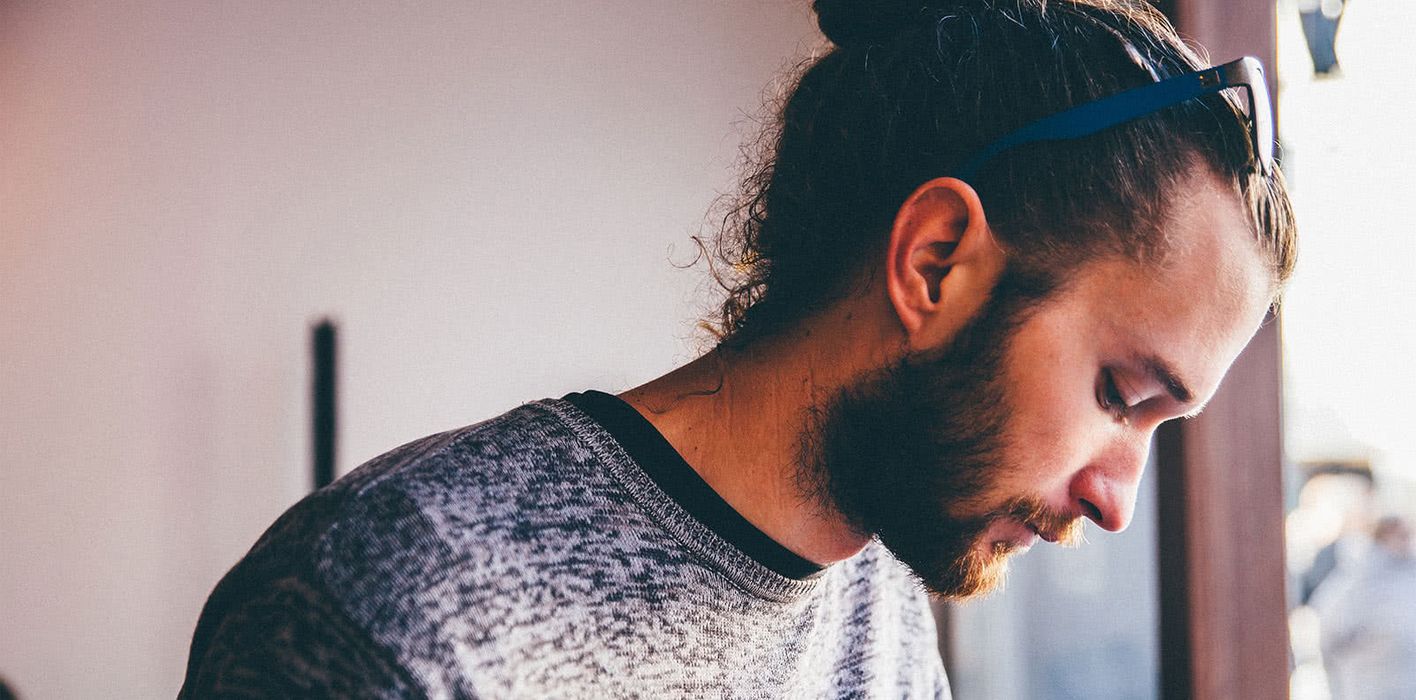 Contemplative young man going through a divorce