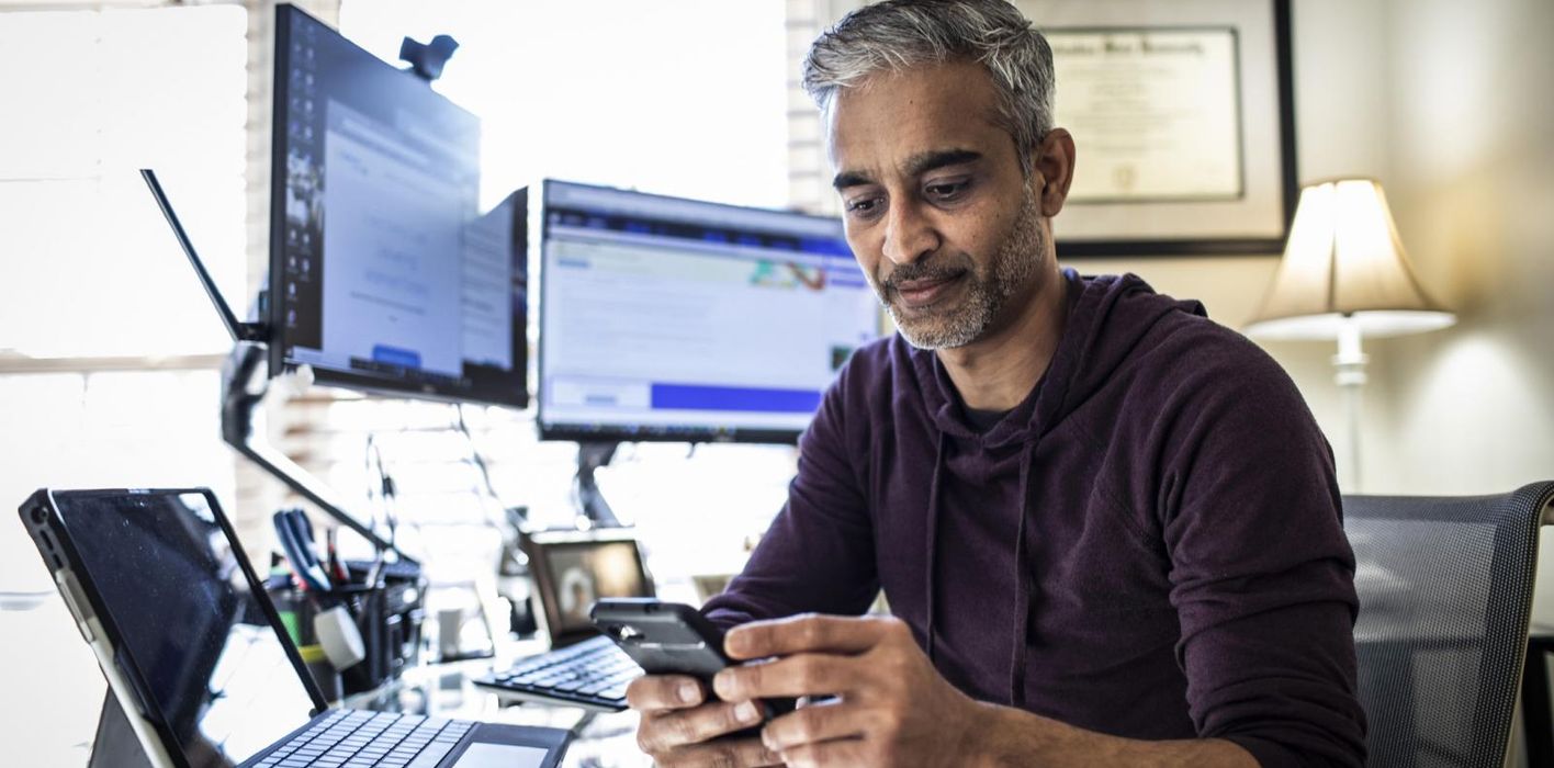 Man at work thinking about supplemental life insurance