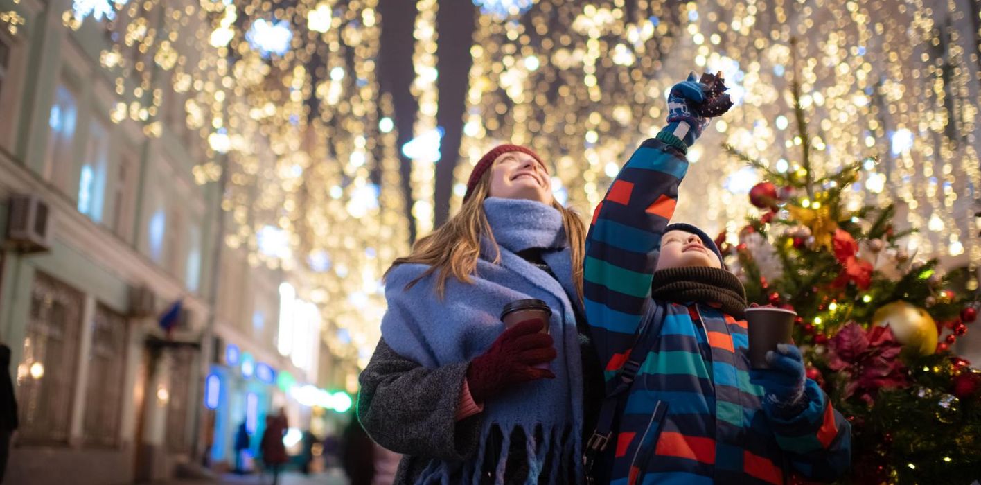 Mother and son explore holiday market while enjoying confidence in their financial plan with Northwestern Mutual.