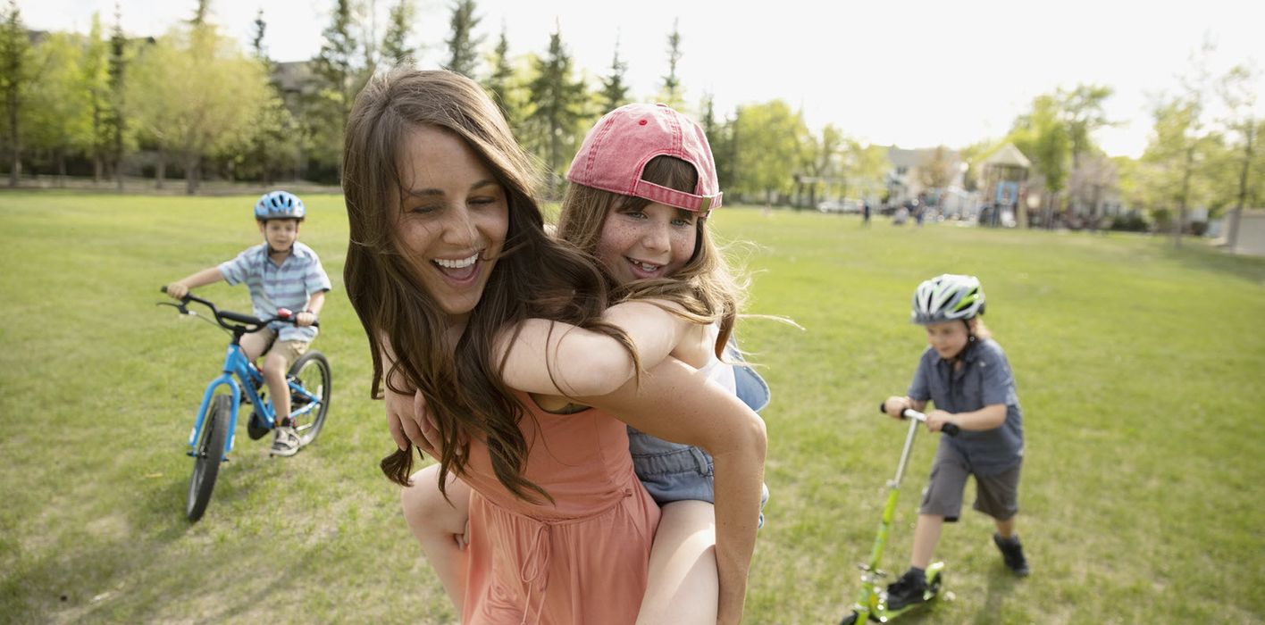 Mom with her kids in a park 