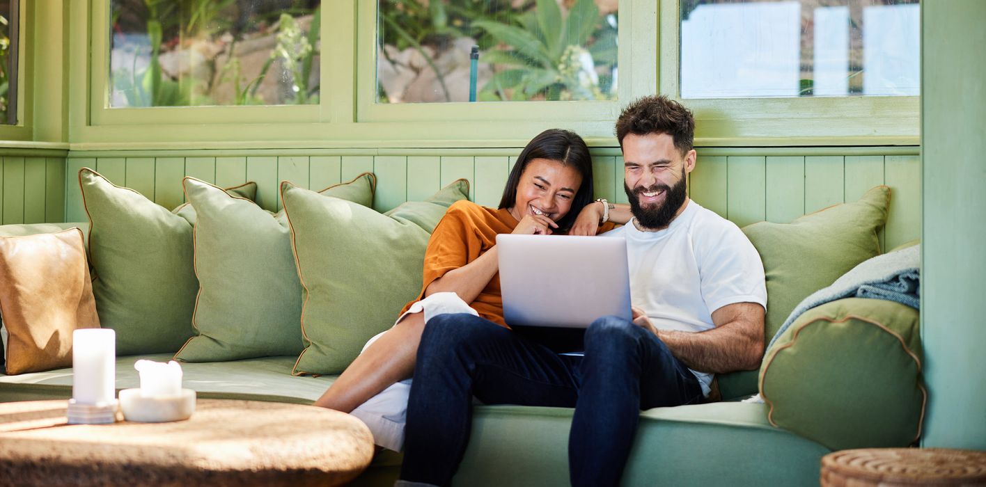Young couple sharing ideas on how to combine their finances.